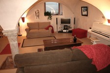 Sitting room with piano and TV